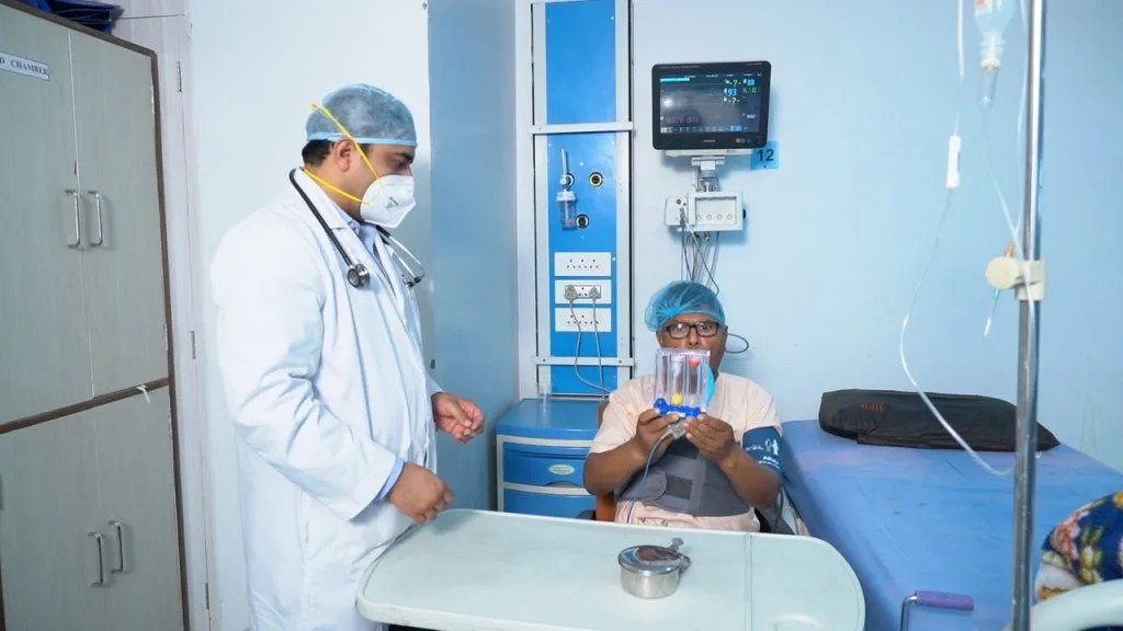 Dr Ashwani Bansal Treating Patient